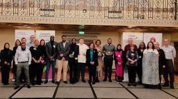 The nominees and winners of the London Borough Apprenticeship Awards stand on the stage at the awards ceremony